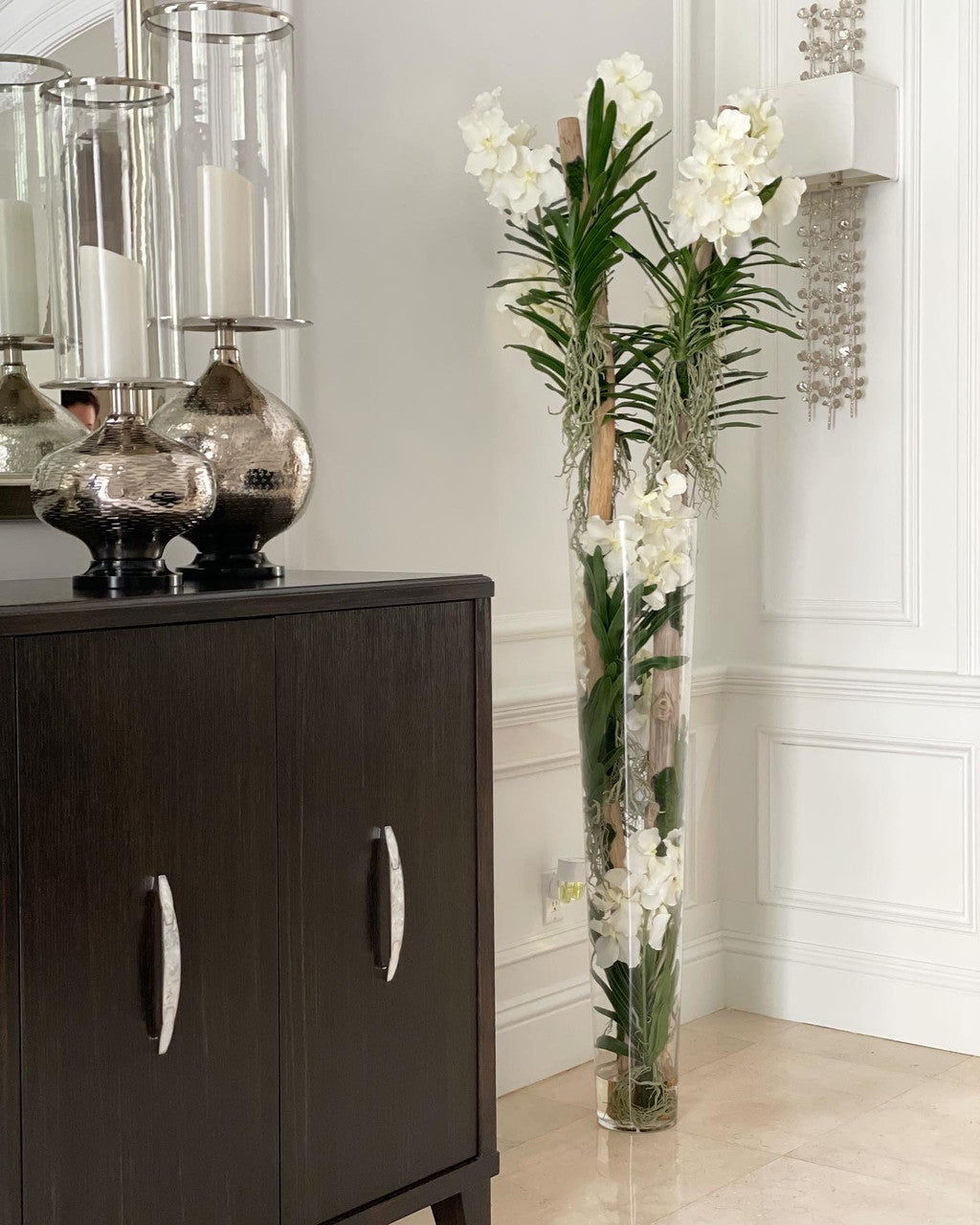 White Vanda Orchids And Driftwood Inside Oversized Tapered Glass Cylinder