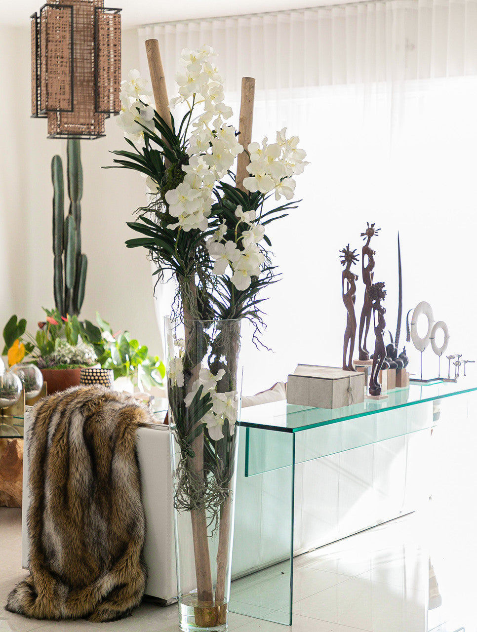 White Vanda Orchids And Driftwood Inside Oversized Tapered Glass Cylinder