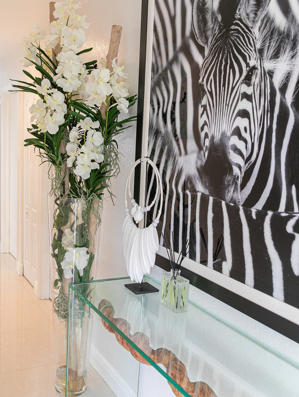 White Vanda Orchids And Driftwood Inside Oversized Tapered Glass Cylinder