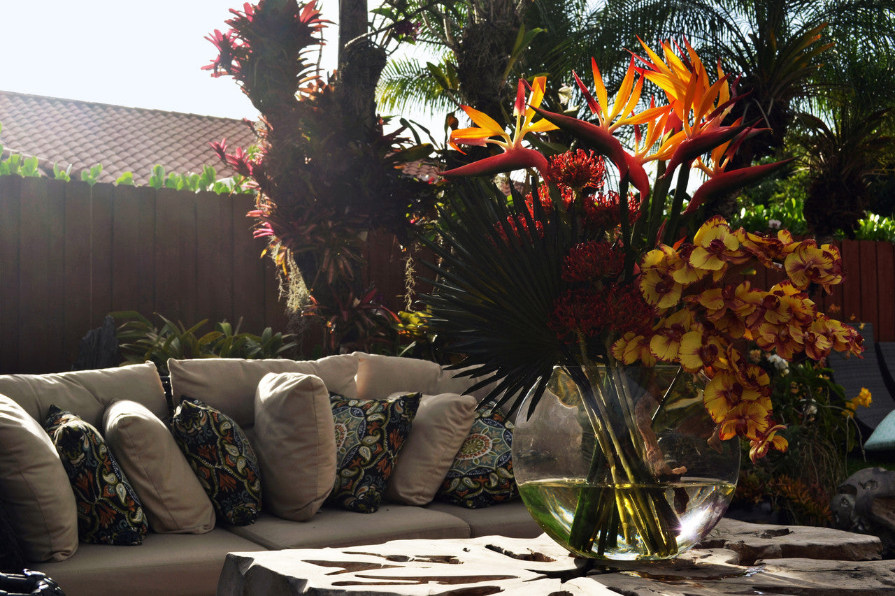 Moon vase with tropical flowers