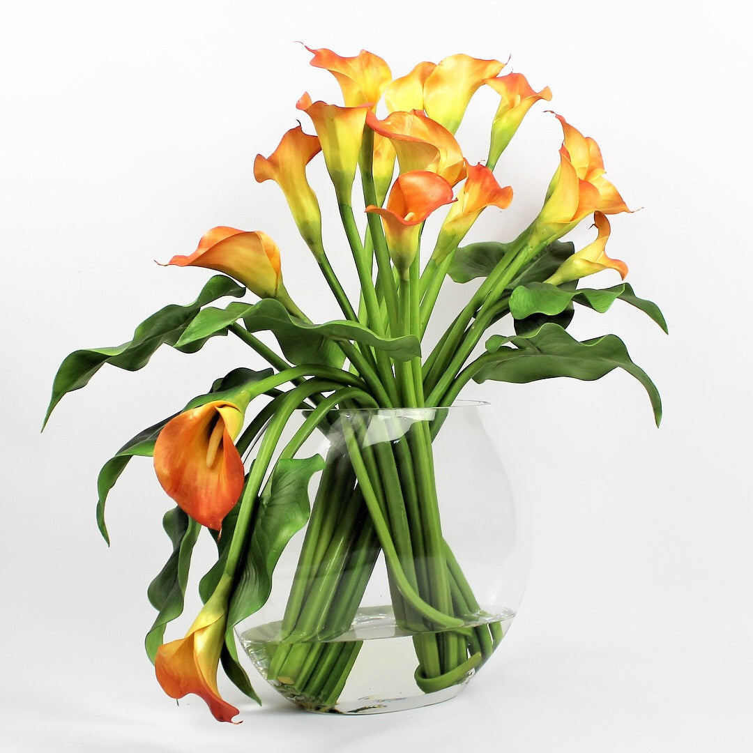 Moon vase with mango calla lilies