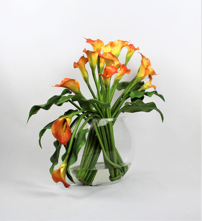 Moon vase with mango calla lilies