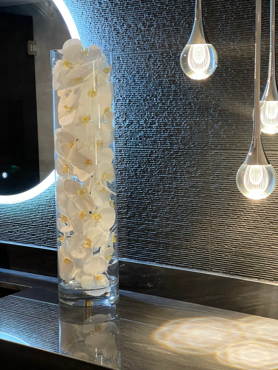 Glass Cylinder With White Phalaenopsis Orchids