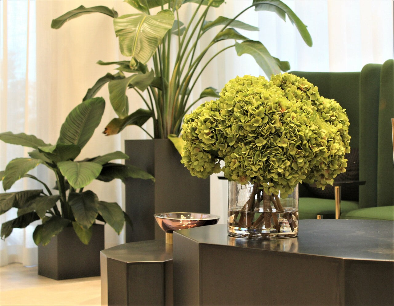 Green Hydrangea Bouquet in clear glass cylinder vase