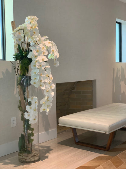 Oversized 39″ Rota cylinder with multiple stems of Phalaenopsis orchids