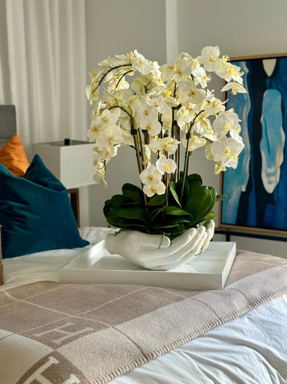 White Phalaenopsis  Orchids in  White Open Hands Sculpture Vase