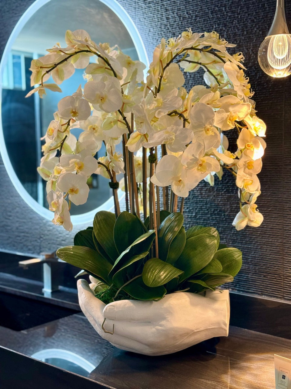 White Phalaenopsis  Orchids in  White Open Hands Sculpture Vase