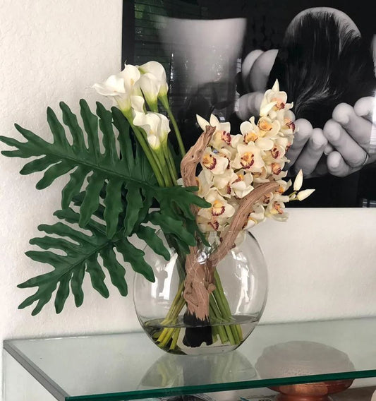 Moon vase with cymbidiums and callas